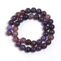 Macro detail of purple and dark red crackle glass beads on pink cord for DIY jewelry - Purple Orange Floral Round Bead