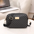 Crossbody square bag in black monogram pattern with adjustable wide strap and gold hardware - Black