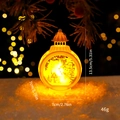 White Christmas lantern featuring a snowman scene with warm yellow LED candle light - Round Wind Lamp - White Snowman