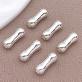 Silver-plated bamboo joint spacer beads for DIY jewelry making on brown fabric - 3.5x9mm / Thick Silver