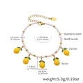 Detailed view of daisy shell beads and yellow resin lemon pendants with green zircon leaves - 5 Lemon Pendants Beaded Style (TXE288-2)