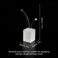 Frosted acrylic earring display stand with curved hooks on a black background - Fireworks Earring Stand Medium (Brushed)