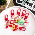 6-piece Christmas resin keychain set with Santa, deer and tree on a white display plate - DC Christmas Resin Pendant 1pc