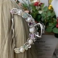 Semicircular metal hair claw clip with colorful natural amethyst and pearls on blonde hair - Fluorite Deep Sea Pearl Silver Hair Claw