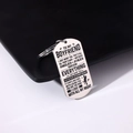 Detail of engraved stainless steel military tag keychain with romantic quote and silhouette - Style 20 (To Boyfriend Message)