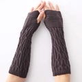 Close-up of dark coffee cable knit arm warmers with a fingerless design and thick wool texture - Dark Gray