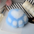 Detailed close-up of blue and white plush cat paw keychain with warm aesthetic background - Sky Blue