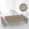 Detail of khaki non-slip pant hangers with adjustable clips and durable metal hooks - Khaki