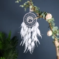 Detail shot of a white dreamcatcher with Tree of Life pattern and soft feathers - 9501 White Tree of Life
