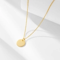 Minimalist gold necklace with a polished round disc pendant on a delicate chain - 925 Silver / Gold