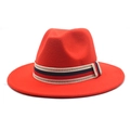 Detailed macro view of the bright red wool fedora hat with Greek key pattern ribbon - Orange Red