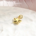 Macro shot of a minimalist gold starfish charm pendant for DIY jewelry making and crafts - Starfish / Gold