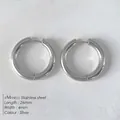 Polished silver stainless steel hoop earrings in 26mm diameter and 4mm width - Silver (NE93148)