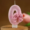 Rosa Geburtstagskerze Zahl 0 mit Glitzer-Finish und einer 3D-Schleifen-Dekoration - Nummer 0