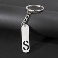 Silver metal keychain with rectangular pendant featuring a hollow S letter design - Letter S
