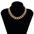 Exaggerated chunky gold-toned aluminum cuban link necklace on black display bust - Textured Gold Cuban Chain