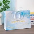 Blue marble gift bag with gold foil accents, white rope handles and a silk bow - Blue Quicksand