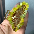Detailed close-up of golden leaf hair claw with hand-wound green crystal stone chips - Korean Jade Gold Butterfly