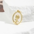 Oval gold rose pendant with white pearlescent inlay on a textured stone background - Rose Style (ZYN-DMK659G)