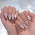 Detailed macro shot of almond-shaped cat eye grey press-on nails with rhinestone accents - Bz1360 Agate Star / Glue Type