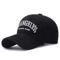 Black cotton baseball cap featuring vintage white embroidery and curved brim style - Black