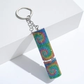 Macro detail of sparkly rainbow rhinestone lipstick shape perfume bottle keychain - C8-Soft Rainbow