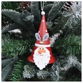 Gros plan d'une cloche Père Noël en fer suspendue à une branche de sapin de Noël - Père Noël Grande Cloche / Rouge/Blanc