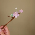 Close-up of bamboo-style hair pin featuring pink flowers, green leaves, and cream beads - Bamboo Pink Flower (S402)