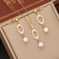 Detail of gold heart jewelry set with white pearls and crystals in a beige gift box - Golden Oval Style (#4 Oval)
