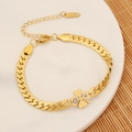 Detail of gold chain bracelet with clover and evil eye charms on a white plate - Four-leaf Clover Evil Eye Style (5#)