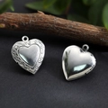 Polished silver heart locket pendant in stainless steel for DIY photos on grey stone background - Ruyi Pattern Heart Locket 13*13.5mm / Raw Blank