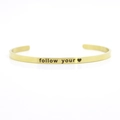 4mm gold stainless steel open cuff bracelet with follow your heart engraving - follow your (heart)