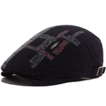 Berretto newsboy blu scuro con patchwork a quadri grigi e ricami laterali - Regolabile / Blu navy