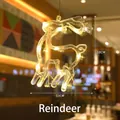 Hanging reindeer LED suction cup window light in warm white for Christmas decor - Deer