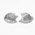 Macro shot of silver fan-shaped earrings featuring 3D wavy textures and metallic luster - Silver (PDE2025)