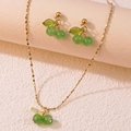 Elegant gold-tone cherry pendant necklace and earring set with green translucent beads - Necklace and Earring Set / Green