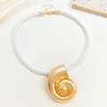 Detail of gold hammer-textured conch pendant on a thick white woven cord necklace - Gold Conch Necklace (N-550)