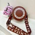 Brown circular crossbody bag with PARCHITA logo and wide patterned shoulder strap - Dark Brown