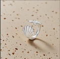 Macro detail of silver-tone open ring featuring a seashell and starfish design - Adjustable Open / Silver Starfish Scallop (WJZ563-2)