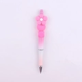 Close-up of pink gradient DIY beaded pen with silicone flower and heart toppers - Rose Red Flower