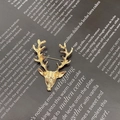 Elegant gold-tone metallic reindeer brooch accessory displayed on vintage background - Gold Style (X0199)