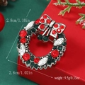Detailed size view of silver Christmas wreath brooch with red and green rhinestones - Vintage Wreath (BR1438)