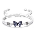 Detail of white woven rope bracelet with blue butterfly pendant and rhinestone accents - White