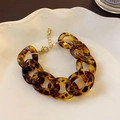Detail of tortoise shell acrylic chunky chain bracelet with gold metal clasp on white tray - 39# Bracelet - Gold - Brown Pig Nose Thick Chain