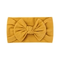 Soft yellow baby nylon headband with large bow detail and stretchy fabric texture - Gold Yellow