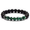 Detailed shot of black lava rock and green malachite beads with silver spacers - Malachite