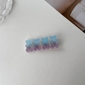 Macro shot of bear-shaped hair clips with a realistic frosted purple gradient finish - Blue
