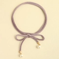 Detail of lavender velvet tie belt with gold metal ends and white pearl charms - Light Purple