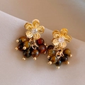 Macro detail of gold flower stud earrings with resin beads and dangling fringe accents - Zircon Flower Tiger Eye Tassel Studs (925 Sterling Silver Earring Post)