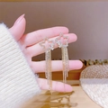Elegant gold drop earrings with crystal-encrusted star and long fringe tassel charms - Gold Hollow Five-Pointed Star Multi-Layer Long Tassel Earrings (E0091)
